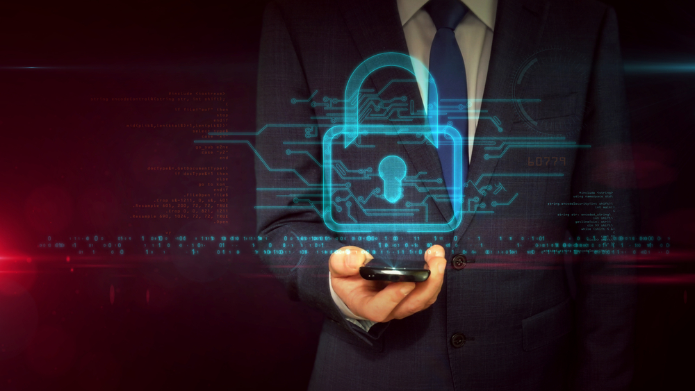 Businessman,In,Suit,Using,Smartphone,With,Padlock,Hologram.,Cyber,Security