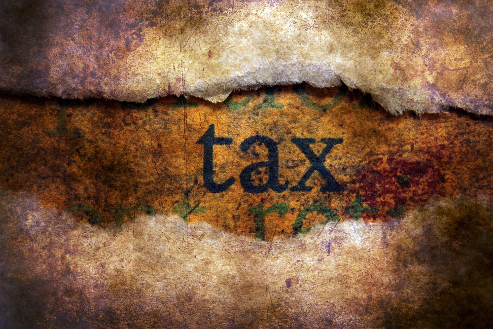 Tax,Text,On,Paper,Hole,Concept