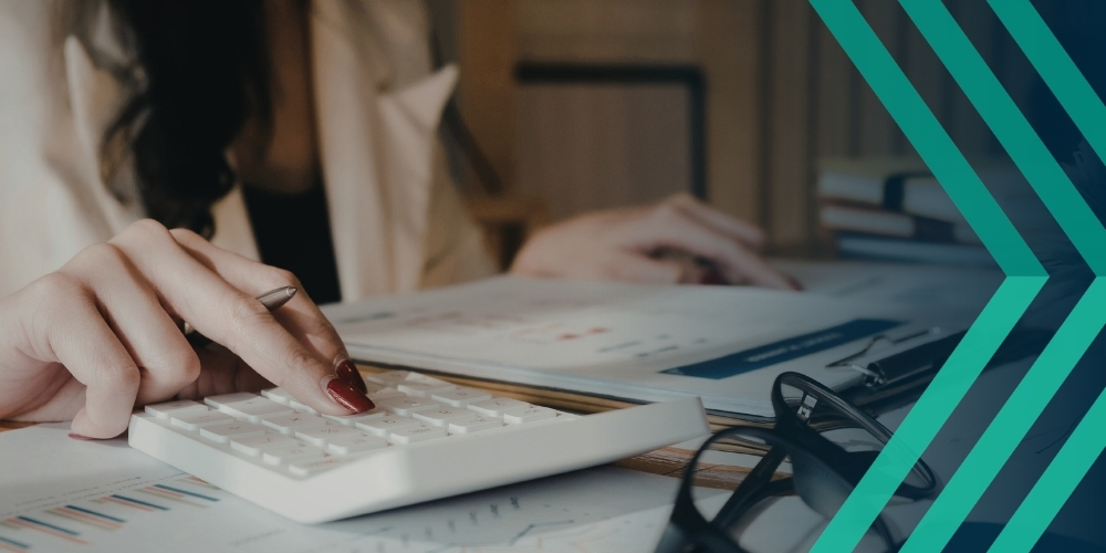 Image of person looking at documents with a calculator, representing article on Make Work Pay umbrella consultation and impact on recruitment agencies