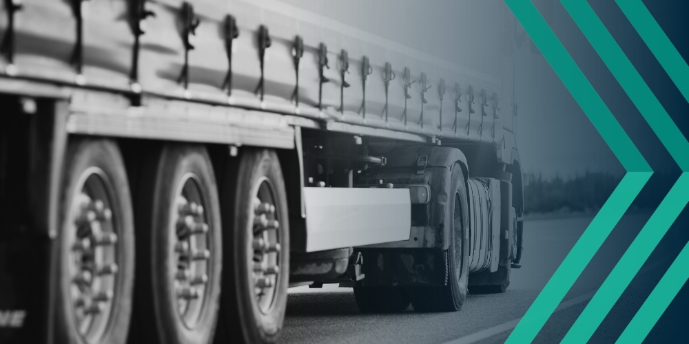 Black and white close-up image of heavy goods vehicle, representing article looking at temporary driver shortages and recruiter risks from rushed hiring