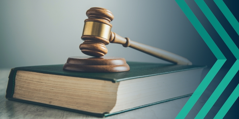 Judge's gavel resting on a book, representing article on the Employment Rights Act 2025 and impacts on recruitment hiring strategies