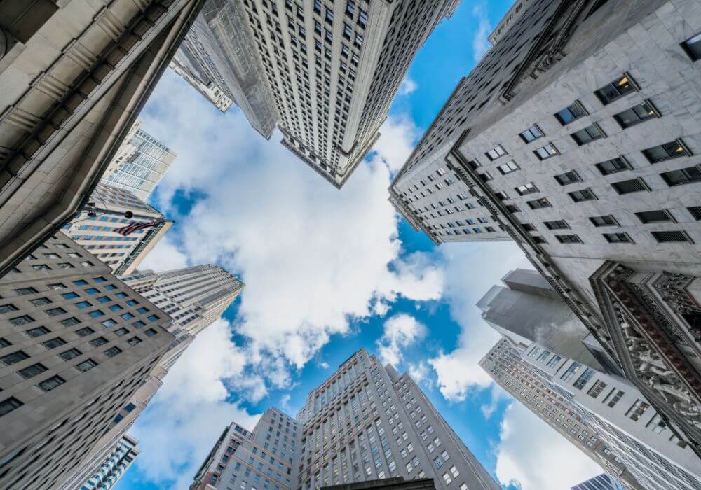 Photo looking at up New York skyscrapers from below, representing article on UK recruiter mistakes when expanding to the US