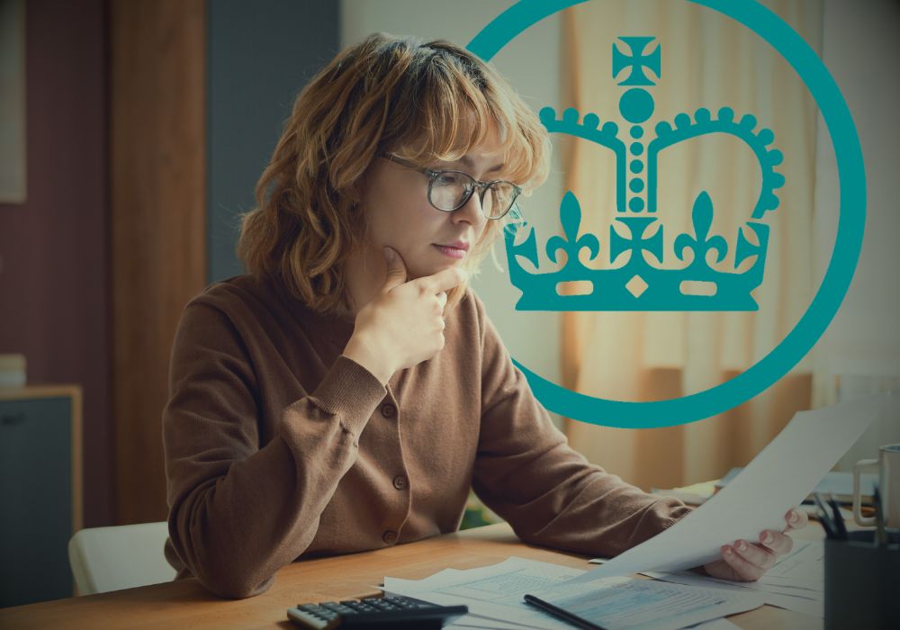 Image of female professional reading business documents with HMRC logo superimposed, representing article on compliance scrutiny recruiters face from HMRC