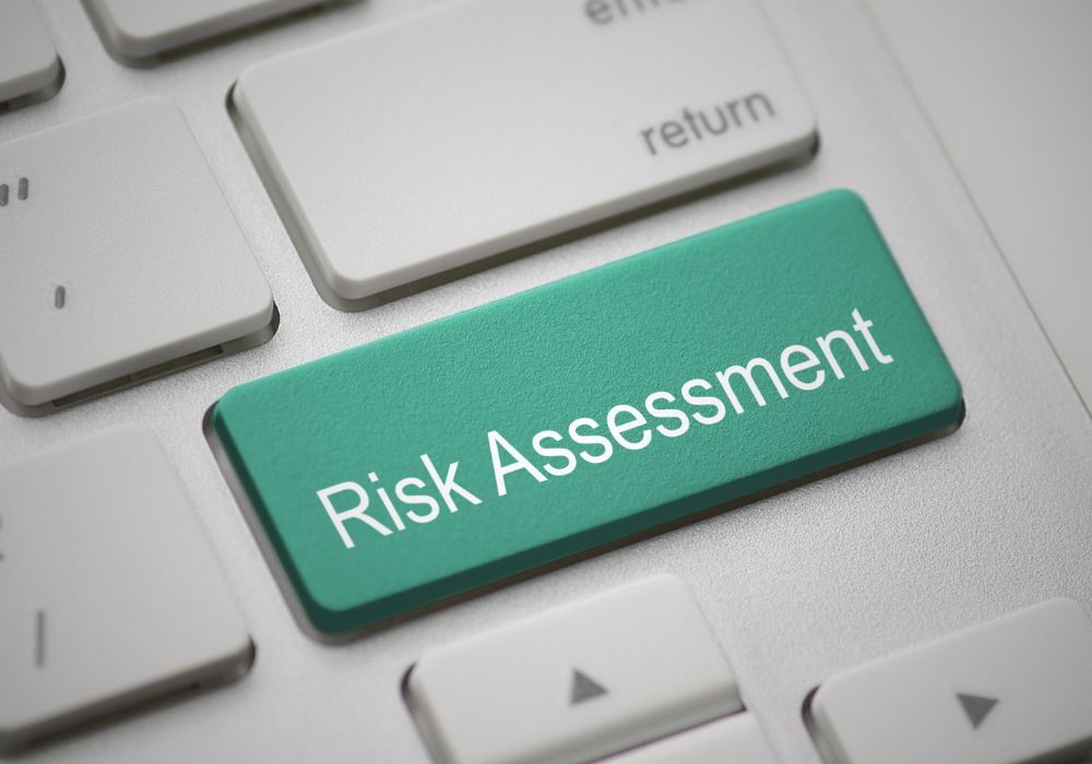 Image of 'shift' keyboard key with 'risk assessment' superimposed, representing article outlining questions for a recruiter risk audit